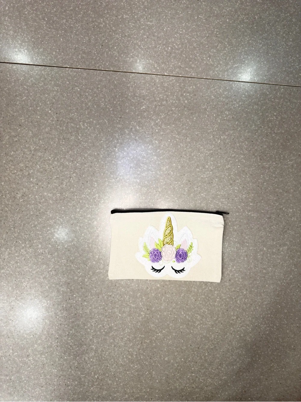 Cosmetic bag with unicorn.  Design is on both sides.  8 x 5